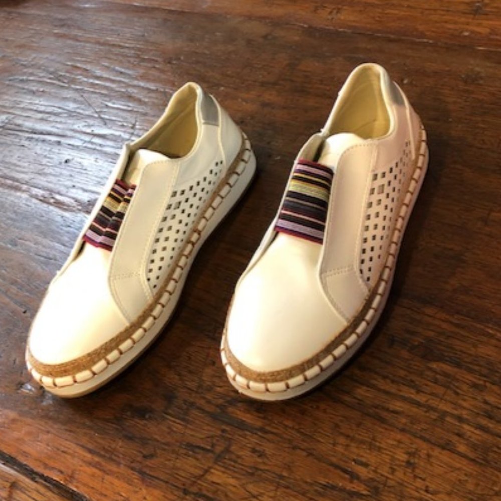 White shoes with colorful band and cut out design